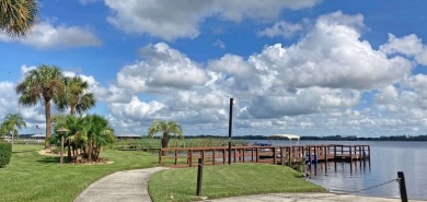 Discover a charming 2-bedroom, 2-bathroom home in the Swiss on Lake Henry Golf Club in Florida - for sale on GolfHomes.com, golf home, golf lot