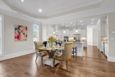 Discover luxury living in this stunning, end-unit townhome on on TPC at Wakefield Plantation in North Carolina - for sale on GolfHomes.com, golf home, golf lot