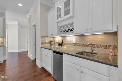 Discover luxury living in this stunning, end-unit townhome on on TPC at Wakefield Plantation in North Carolina - for sale on GolfHomes.com, golf home, golf lot