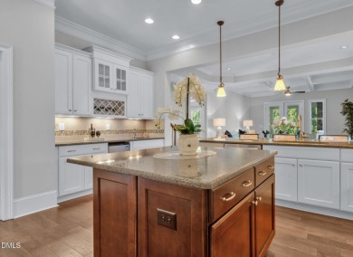 Discover luxury living in this stunning, end-unit townhome on on TPC at Wakefield Plantation in North Carolina - for sale on GolfHomes.com, golf home, golf lot