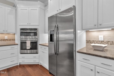 Discover luxury living in this stunning, end-unit townhome on on TPC at Wakefield Plantation in North Carolina - for sale on GolfHomes.com, golf home, golf lot