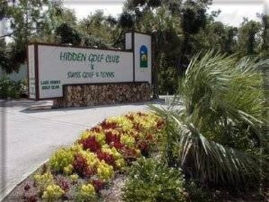 A charming home in the desirable Hidden Golf Community. Welcome on Lake Henry Golf Club in Florida - for sale on GolfHomes.com, golf home, golf lot