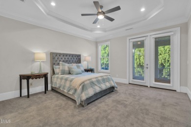 Discover luxury living in this stunning, end-unit townhome on on TPC at Wakefield Plantation in North Carolina - for sale on GolfHomes.com, golf home, golf lot