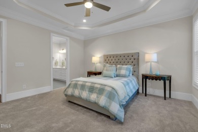 Discover luxury living in this stunning, end-unit townhome on on TPC at Wakefield Plantation in North Carolina - for sale on GolfHomes.com, golf home, golf lot