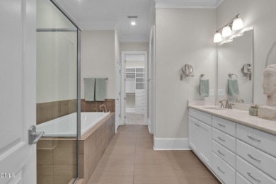 Discover luxury living in this stunning, end-unit townhome on on TPC at Wakefield Plantation in North Carolina - for sale on GolfHomes.com, golf home, golf lot