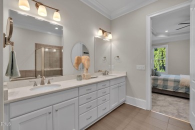 Discover luxury living in this stunning, end-unit townhome on on TPC at Wakefield Plantation in North Carolina - for sale on GolfHomes.com, golf home, golf lot