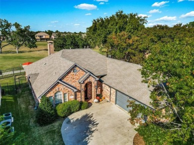 Welcome to your dream home! Nestled along the scenic fairways on Stewart Peninsula Golf Course in Texas - for sale on GolfHomes.com, golf home, golf lot