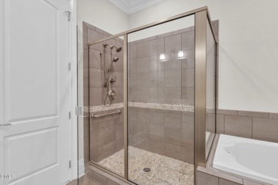 Discover luxury living in this stunning, end-unit townhome on on TPC at Wakefield Plantation in North Carolina - for sale on GolfHomes.com, golf home, golf lot