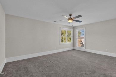 Discover luxury living in this stunning, end-unit townhome on on TPC at Wakefield Plantation in North Carolina - for sale on GolfHomes.com, golf home, golf lot