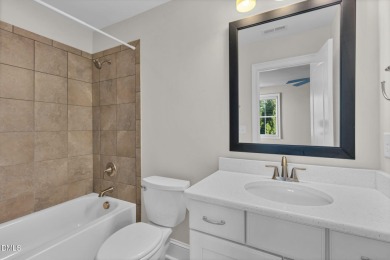 Discover luxury living in this stunning, end-unit townhome on on TPC at Wakefield Plantation in North Carolina - for sale on GolfHomes.com, golf home, golf lot
