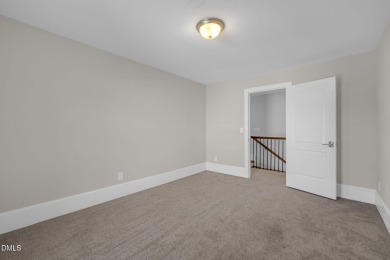 Discover luxury living in this stunning, end-unit townhome on on TPC at Wakefield Plantation in North Carolina - for sale on GolfHomes.com, golf home, golf lot