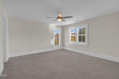 Discover luxury living in this stunning, end-unit townhome on on TPC at Wakefield Plantation in North Carolina - for sale on GolfHomes.com, golf home, golf lot