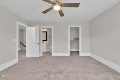 Discover luxury living in this stunning, end-unit townhome on on TPC at Wakefield Plantation in North Carolina - for sale on GolfHomes.com, golf home, golf lot