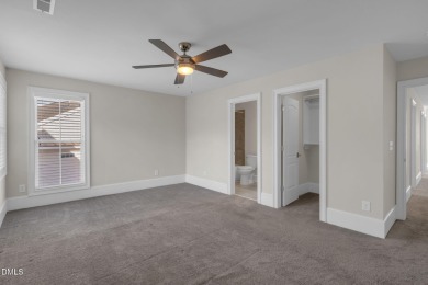 Discover luxury living in this stunning, end-unit townhome on on TPC at Wakefield Plantation in North Carolina - for sale on GolfHomes.com, golf home, golf lot