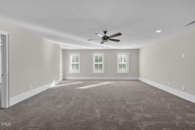 Discover luxury living in this stunning, end-unit townhome on on TPC at Wakefield Plantation in North Carolina - for sale on GolfHomes.com, golf home, golf lot