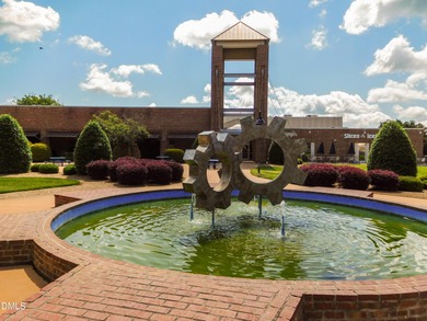 Discover luxury living in this stunning, end-unit townhome on on TPC at Wakefield Plantation in North Carolina - for sale on GolfHomes.com, golf home, golf lot