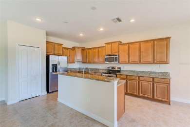 Want to live like you've retired to the house of your dreams on The Oasis Club at Champions Gate in Florida - for sale on GolfHomes.com, golf home, golf lot