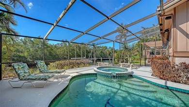 Wrapped in lush, mature landscaping and set along a tranquil on Longboat Key Golf Club Resort in Florida - for sale on GolfHomes.com, golf home, golf lot