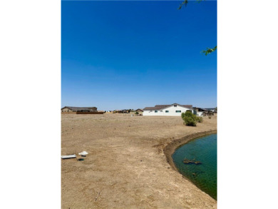 Escape to your own slice of paradise, an exceptional .24 acre on Los Lagos Golf Club in Arizona - for sale on GolfHomes.com, golf home, golf lot