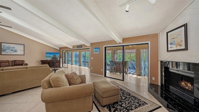 Wrapped in lush, mature landscaping and set along a tranquil on Longboat Key Golf Club Resort in Florida - for sale on GolfHomes.com, golf home, golf lot