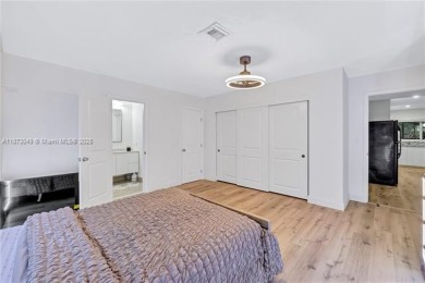 Nestled on a spectacular, tree-lined site in a quiet, low on Orangebrook Golf and Country Club in Florida - for sale on GolfHomes.com, golf home, golf lot