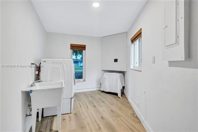 Nestled on a spectacular, tree-lined site in a quiet, low on Orangebrook Golf and Country Club in Florida - for sale on GolfHomes.com, golf home, golf lot