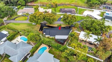 Nestled on a spectacular, tree-lined site in a quiet, low on Orangebrook Golf and Country Club in Florida - for sale on GolfHomes.com, golf home, golf lot