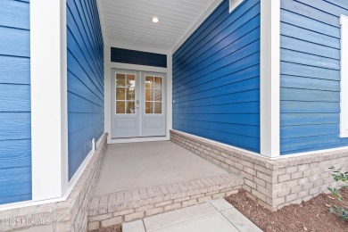 This brand new Riptide home with stunning setting and finishes on Sea Trail Golf Resort in North Carolina - for sale on GolfHomes.com, golf home, golf lot