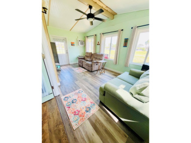This stunning two-bedroom, two-bathroom home in Pine Lakes on Pine Lakes Country Club in Florida - for sale on GolfHomes.com, golf home, golf lot