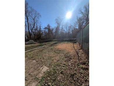 Nestled on a quiet, well-manicured street in the charming town on Normandie Golf Club in Missouri - for sale on GolfHomes.com, golf home, golf lot