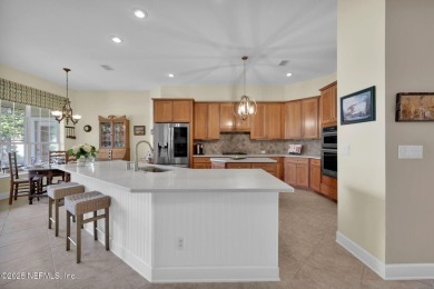 This elegant David Weekley home offers panoramic water views on The Palencia Club in Florida - for sale on GolfHomes.com, golf home, golf lot