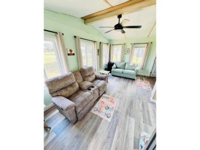 This stunning two-bedroom, two-bathroom home in Pine Lakes on Pine Lakes Country Club in Florida - for sale on GolfHomes.com, golf home, golf lot