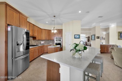 This elegant David Weekley home offers panoramic water views on The Palencia Club in Florida - for sale on GolfHomes.com, golf home, golf lot