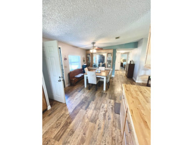 This stunning two-bedroom, two-bathroom home in Pine Lakes on Pine Lakes Country Club in Florida - for sale on GolfHomes.com, golf home, golf lot