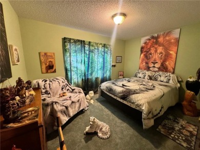 Discover the charm of this enchanting country home in Park on Headwaters Country Club in Minnesota - for sale on GolfHomes.com, golf home, golf lot
