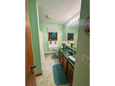 Discover the charm of this enchanting country home in Park on Headwaters Country Club in Minnesota - for sale on GolfHomes.com, golf home, golf lot