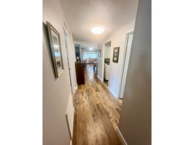 This stunning two-bedroom, two-bathroom home in Pine Lakes on Pine Lakes Country Club in Florida - for sale on GolfHomes.com, golf home, golf lot
