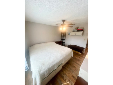 This stunning two-bedroom, two-bathroom home in Pine Lakes on Pine Lakes Country Club in Florida - for sale on GolfHomes.com, golf home, golf lot