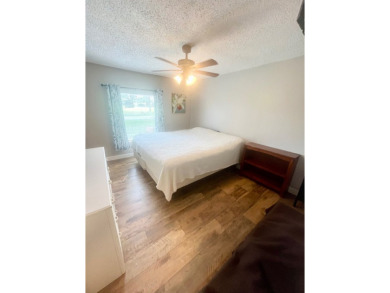 This stunning two-bedroom, two-bathroom home in Pine Lakes on Pine Lakes Country Club in Florida - for sale on GolfHomes.com, golf home, golf lot