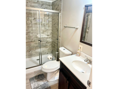 This stunning two-bedroom, two-bathroom home in Pine Lakes on Pine Lakes Country Club in Florida - for sale on GolfHomes.com, golf home, golf lot