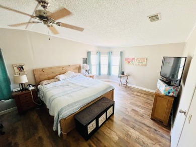 This stunning two-bedroom, two-bathroom home in Pine Lakes on Pine Lakes Country Club in Florida - for sale on GolfHomes.com, golf home, golf lot