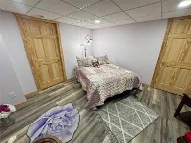 Discover the charm of this enchanting country home in Park on Headwaters Country Club in Minnesota - for sale on GolfHomes.com, golf home, golf lot