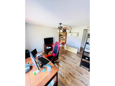 This stunning two-bedroom, two-bathroom home in Pine Lakes on Pine Lakes Country Club in Florida - for sale on GolfHomes.com, golf home, golf lot