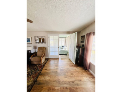 This stunning two-bedroom, two-bathroom home in Pine Lakes on Pine Lakes Country Club in Florida - for sale on GolfHomes.com, golf home, golf lot