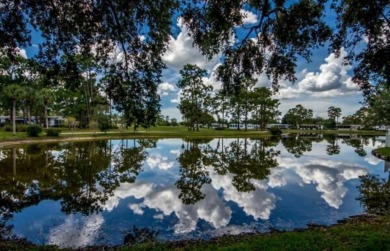 This stunning two-bedroom, two-bathroom home in Pine Lakes on Pine Lakes Country Club in Florida - for sale on GolfHomes.com, golf home, golf lot