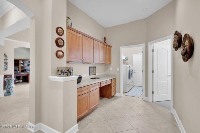 This elegant David Weekley home offers panoramic water views on The Palencia Club in Florida - for sale on GolfHomes.com, golf home, golf lot