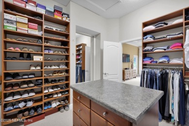 This elegant David Weekley home offers panoramic water views on The Palencia Club in Florida - for sale on GolfHomes.com, golf home, golf lot