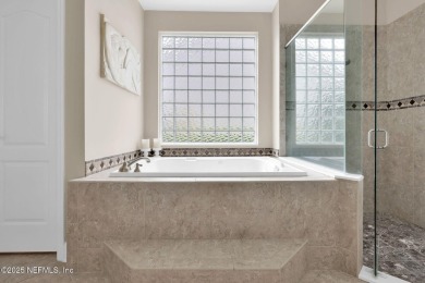 This elegant David Weekley home offers panoramic water views on The Palencia Club in Florida - for sale on GolfHomes.com, golf home, golf lot