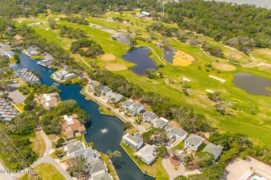 Rooted among the majestic live oaks and the lush landscaping of on The Country Club of the Crystal Coast in North Carolina - for sale on GolfHomes.com, golf home, golf lot