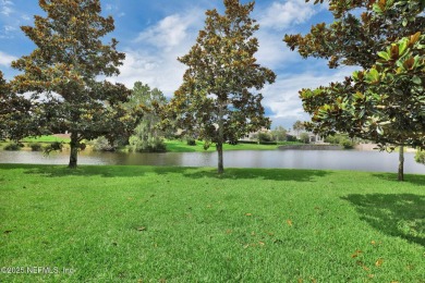 This elegant David Weekley home offers panoramic water views on The Palencia Club in Florida - for sale on GolfHomes.com, golf home, golf lot